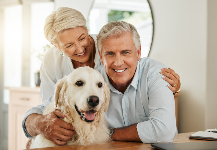 Elderly couple with healthy looking dog