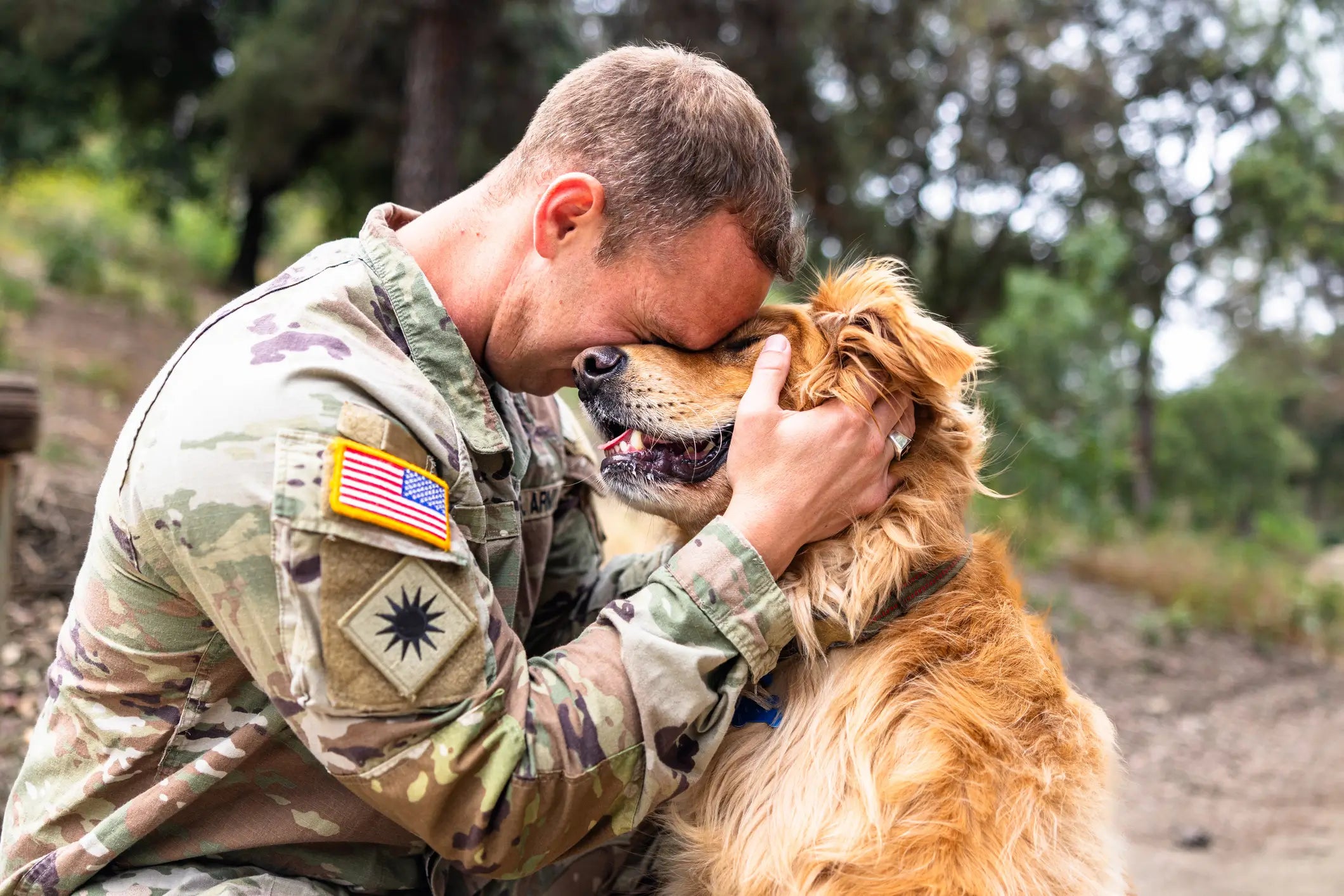 Veteran with head on Service Dog