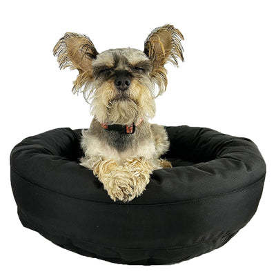 Round bolster dog bed with supportive cushioned rim