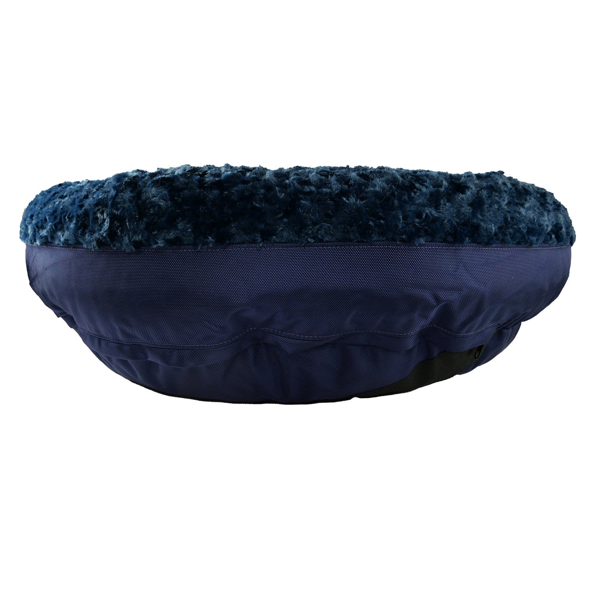 Side view of a round bolster bed with navy blue plush top and navy fabric base