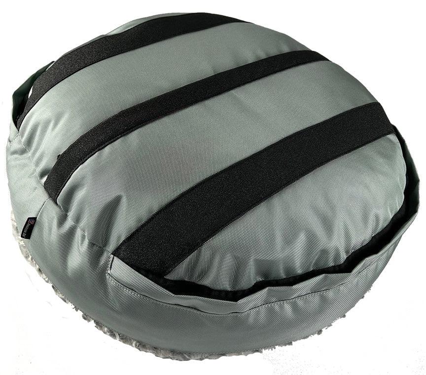 Underside of a gray round dog bed showing black non-slip grip strips