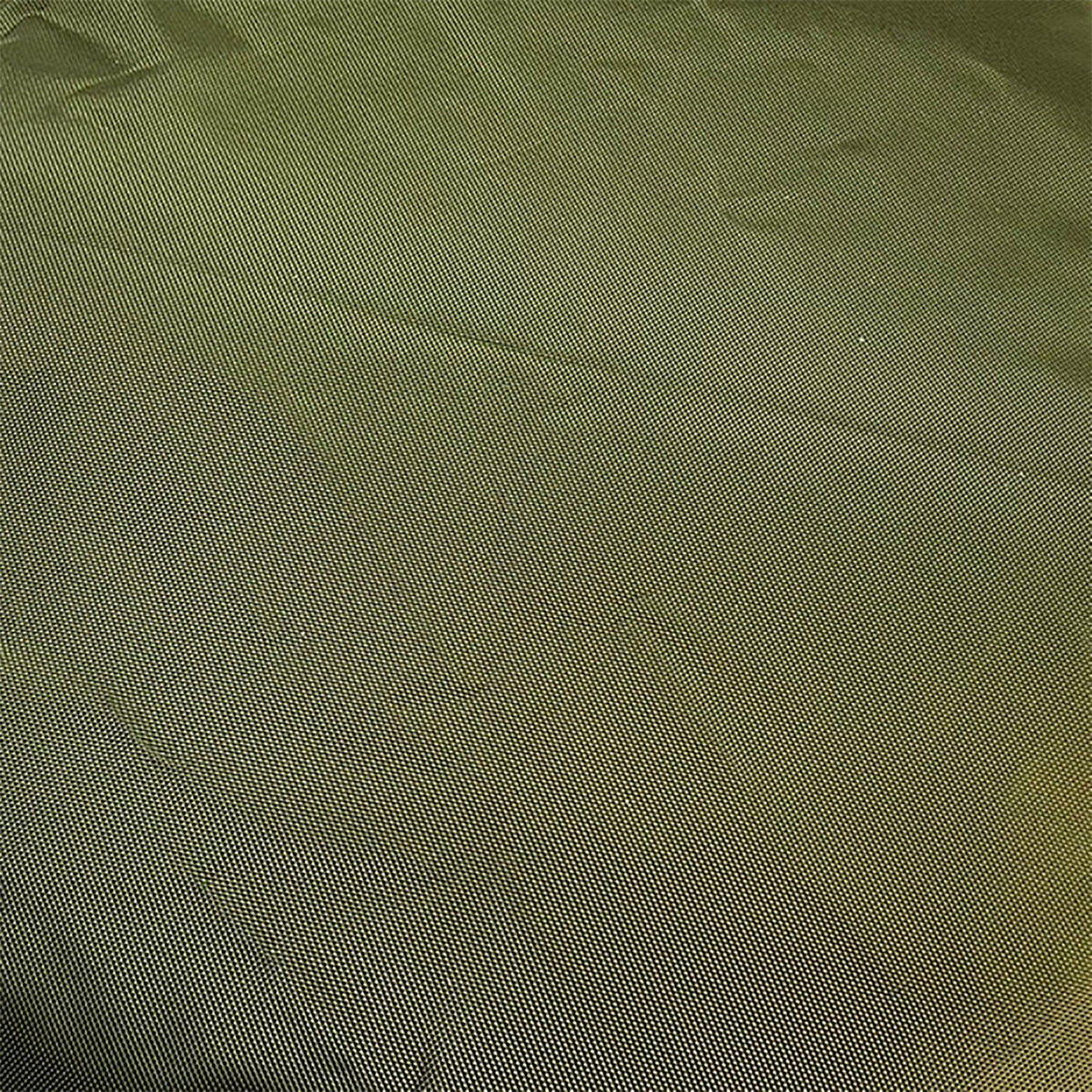 Close-up of olive green ballistic weave fabric on the Armor rectangular dog bed