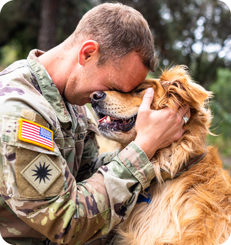 soldier hugging dog